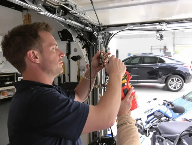 Simsbury Garage Door Repair safety certified technician performing cable replacement in Simsbury