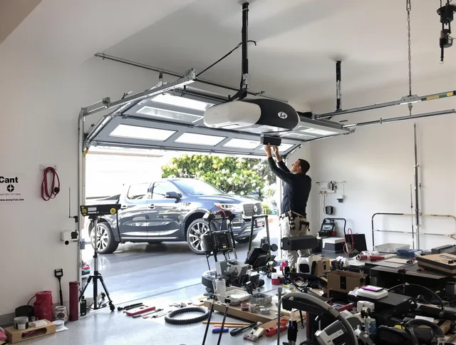 Simsbury Garage Door Repair specialist installing smart garage door opener system in Simsbury home