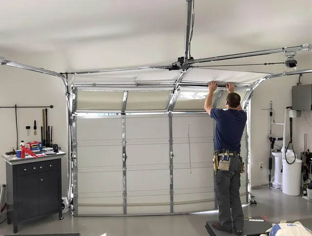 Simsbury Garage Door Repair specialist performing precise section replacement on Simsbury garage door