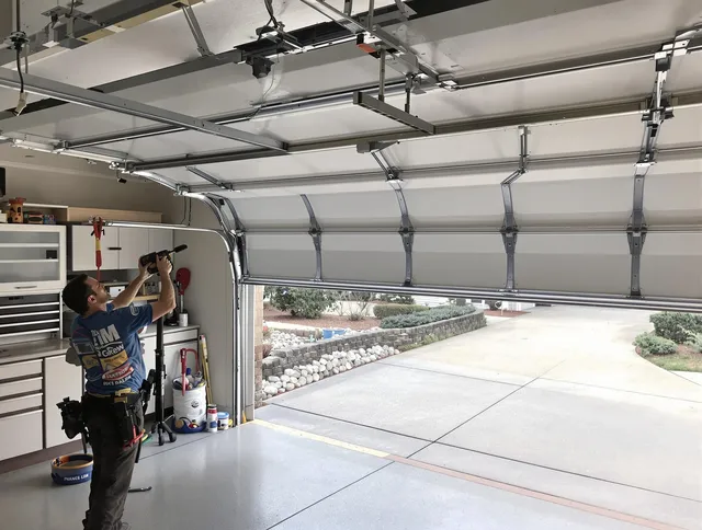 Garage door track repair service by Simsbury Garage Door Repair in Simsbury